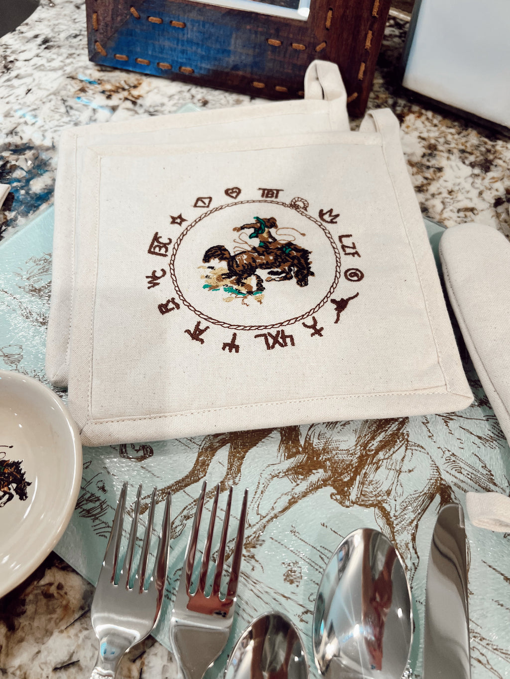The Bronc Pot Holder Set