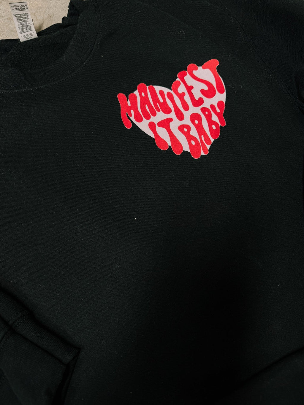 Manifest It, Baby – Black Hanes Crewneck (Front & Back Print) - Quarter Circle AK Boutique