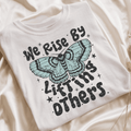 We rise by lifting others tee or sweatshirt - Quarter Circle AK Boutique