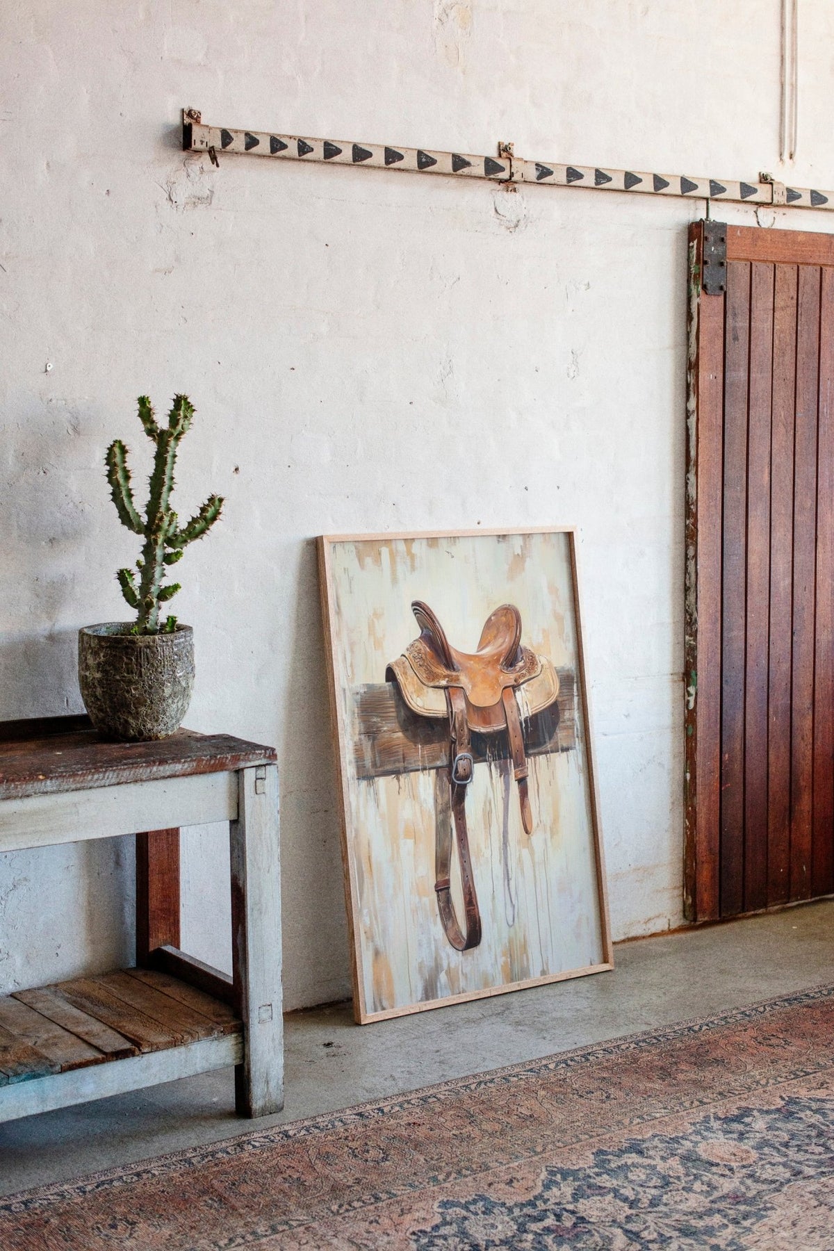 Weathered Rest: Western Saddle Still Life - Quarter Circle AK Boutique